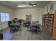 Community library with bookshelves, tables, chairs, and computer workstation for residents' use at 3330 E Main St # 121, Mesa, AZ 85213