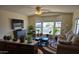Well-lit living room featuring a fireplace, big windows, and neutral color scheme at 3330 E Main St # 121, Mesa, AZ 85213