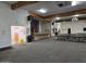 Spacious meeting room with wood beam accents, stage, and rows of tables and chairs at 3330 E Main St # 121, Mesa, AZ 85213