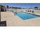 Outdoor community pool surrounded by lounge chairs for relaxation at 3330 E Main St # 121, Mesa, AZ 85213
