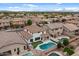 Aerial view of the home showcasing the backyard pool, patio, and surrounding neighborhood at 3523 E Alfalfa Dr, Gilbert, AZ 85298
