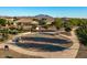 Community basketball court with benches and desert landscaping at 3523 E Alfalfa Dr, Gilbert, AZ 85298