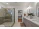 Spa-like bathroom with a glass-enclosed shower, double vanity, and modern fixtures at 3523 E Alfalfa Dr, Gilbert, AZ 85298