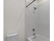 Full bathtub with a shower head, sleek fixtures, and light tile at 3523 E Alfalfa Dr, Gilbert, AZ 85298