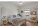 Bright bedroom featuring a ceiling fan, natural light and stylish decor at 3523 E Alfalfa Dr, Gilbert, AZ 85298