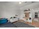 Well lit bedroom featuring a ceiling fan, workspace and toy decorations at 3523 E Alfalfa Dr, Gilbert, AZ 85298