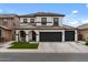 Beautiful two-story home featuring a three-car garage, neutral stucco, and a terra cotta colored tile roof at 3523 E Alfalfa Dr, Gilbert, AZ 85298