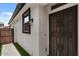 Exterior view showcasing the front door and manicured side yard at 3523 E Alfalfa Dr, Gilbert, AZ 85298