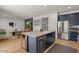 Open-concept kitchen featuring a large island, stainless steel appliances, and sleek, modern cabinetry at 3523 E Alfalfa Dr, Gilbert, AZ 85298