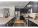 Chef's kitchen offers stainless steel appliances, sleek countertops, and a functional layout with ample cabinet space at 3523 E Alfalfa Dr, Gilbert, AZ 85298