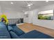 Open living room featuring a mounted TV and hardwood floors at 3523 E Alfalfa Dr, Gilbert, AZ 85298