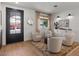 Stylishly decorated living room offering wood floors, neutral paint, designer fixtures, and a large picture window at 3523 E Alfalfa Dr, Gilbert, AZ 85298