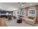 Spacious living room with ample natural light, neutral tones, and a seamless transition to the kitchen at 3523 E Alfalfa Dr, Gilbert, AZ 85298