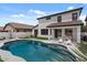 Backyard pool and patio with a well-maintained lawn, perfect for outdoor entertaining at 3523 E Alfalfa Dr, Gilbert, AZ 85298