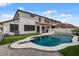 Inviting backyard featuring a sparkling pool and lush greenery, ideal for relaxation and entertainment at 3523 E Alfalfa Dr, Gilbert, AZ 85298