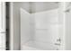 Clean bathroom featuring a shower-tub combo with a white surround at 38005 W Montserrat St, Maricopa, AZ 85138