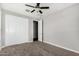 Neutral bedroom featuring a closet and a ceiling fan at 38005 W Montserrat St, Maricopa, AZ 85138