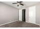 Neutral bedroom featuring a closet and a ceiling fan at 38005 W Montserrat St, Maricopa, AZ 85138