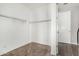 Walk-in closet with built-in shelving, providing ample storage space for an organized lifestyle at 38005 W Montserrat St, Maricopa, AZ 85138