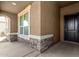 Close-up of front entry with stone accents and decorative door at 38005 W Montserrat St, Maricopa, AZ 85138