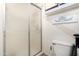 This bathroom features a walk-in shower, toilet, and accent artwork at 3807 W Abraham Ln, Glendale, AZ 85308