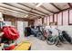 Spacious garage filled with tools and bikes, providing ample storage space at 3807 W Abraham Ln, Glendale, AZ 85308