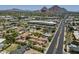 Beautiful aerial view of the home with lush landscaping and city views at 3812 E Camelback Rd, Phoenix, AZ 85018