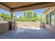Spacious balcony with neutral finishes and views of beautiful green trees and blue skies at 3812 E Camelback Rd, Phoenix, AZ 85018