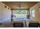 Relaxing covered patio featuring comfortable seating, an outdoor grill, and beautiful views at 3812 E Camelback Rd, Phoenix, AZ 85018