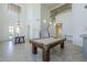Large game room and billiards table; view to dining table and staircase to second level at 3812 E Camelback Rd, Phoenix, AZ 85018