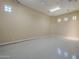 Empty spacious garage with sealed flooring at 3812 E Camelback Rd, Phoenix, AZ 85018