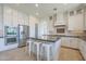 Modern kitchen with ample cabinet space, island seating, and stainless steel appliances at 3812 E Camelback Rd, Phoenix, AZ 85018