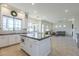 Beautiful kitchen with large center island, tile floors, stainless appliances and open floorplan at 3812 E Camelback Rd, Phoenix, AZ 85018