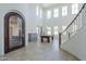 Spacious living room with high ceilings, a billiard table, and plenty of natural light at 3812 E Camelback Rd, Phoenix, AZ 85018