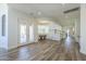 Expansive living area showcases wood flooring, an open floor plan, and plenty of natural light at 3812 E Camelback Rd, Phoenix, AZ 85018