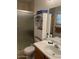 A clean bathroom featuring tiled floors and a sliding glass shower enclosure offers modern convenience at 40047 N Cassara Dr, San Tan Valley, AZ 85140