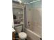 Functional bathroom with a combined shower and tub, complemented by ample storage at 40047 N Cassara Dr, San Tan Valley, AZ 85140