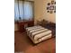 Cozy bedroom with a comfortable bed, classic furniture, and soft natural light at 40047 N Cassara Dr, San Tan Valley, AZ 85140
