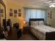 Comfortable bedroom with a queen-size bed, ample natural light, and neutral decor at 40047 N Cassara Dr, San Tan Valley, AZ 85140