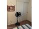 Bedroom with a ceiling fan, carpet, and an electric fan for comfortable climate control at 40047 N Cassara Dr, San Tan Valley, AZ 85140