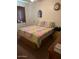 Bright and comfortable bedroom with vintage-style bedding, soft lighting, and practical storage at 40047 N Cassara Dr, San Tan Valley, AZ 85140