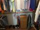 Inside an organized closet with a small dresser and many hanging clothes on hangers at 40047 N Cassara Dr, San Tan Valley, AZ 85140