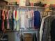 A well-organized closet with clothes neatly hung on hangers and items stacked on shelves at 40047 N Cassara Dr, San Tan Valley, AZ 85140