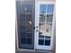 A sliding glass door with hummingbird decals leads outside at 40047 N Cassara Dr, San Tan Valley, AZ 85140