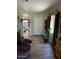 An entryway with durable vinyl flooring, soft green walls, and ample natural light at 40047 N Cassara Dr, San Tan Valley, AZ 85140