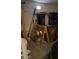 Cluttered garage with workbench at 40047 N Cassara Dr, San Tan Valley, AZ 85140