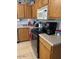 Functional kitchen with light wood cabinetry and stainless steel oven at 40047 N Cassara Dr, San Tan Valley, AZ 85140