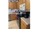 Well-equipped kitchen featuring wood cabinets and stainless steel appliances at 40047 N Cassara Dr, San Tan Valley, AZ 85140