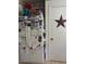 A white refrigerator is covered in photos, art, and keepsakes at 40047 N Cassara Dr, San Tan Valley, AZ 85140