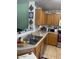 A bright kitchen with tan cabinets and tile backsplash at 40047 N Cassara Dr, San Tan Valley, AZ 85140